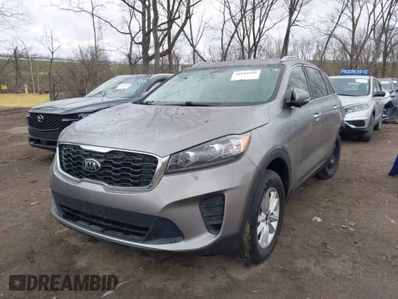 2019 Kia Sorento LX with VIN 5XYPG4A39KG532323, listed as a IAAI auction lot 41844566 with 76,987 mi miles and . Bid and sale history available at DreamBid. Image 2.