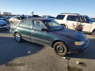 1999 Chevrolet Prizm z VIN 1Y1SK5289XZ411868, wystawiony jako Copart lot #79348064 z przebiegiem 175 202 mil mil oraz Czysty tytuł • Clean title. Historia ofert i sprzedaży dostępna na DreamBid. Obrazek 4.