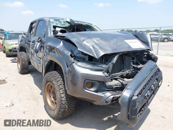 2021 Toyota Tacoma SR5 with VIN 5TFAZ5CN1MX118036, listed as a IAAI auction lot 42840652 with 73,082 mi miles and . Bid and sale history available at DreamBid. Image 1.