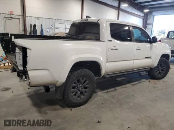 2023 Toyota Tacoma SR5 with VIN 3TYAZ5CN2PT042244, listed as a Copart auction lot 76022534 with 9,551 mi miles and Salvage title. Bid and sale history available at DreamBid. Image 3.