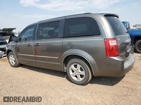 2010 Dodge Grand Caravan SXT z VIN 2D4RN5D11AR467155, wystawiony jako Copart lot #71179835 z przebiegiem 142 262 mil mil oraz Czysty tytuł • Clean title. Historia ofert i sprzedaży dostępna na DreamBid. Obrazek 2.