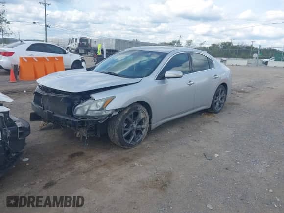 2013 Nissan Maxima S with VIN 1N4AA5AP0DC811642, listed as a IAAI auction lot 43415744 with 198,536 mi miles and . Bid and sale history available at DreamBid. Image 2.