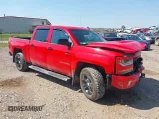 2018 Chevrolet Silverado 1500 LT z VIN 3GCUKREC6JG142529, wystawiony jako IAAI lot #43126958 z przebiegiem 117 342 mil mil oraz . Historia ofert i sprzedaży dostępna na DreamBid. Obrazek 1.