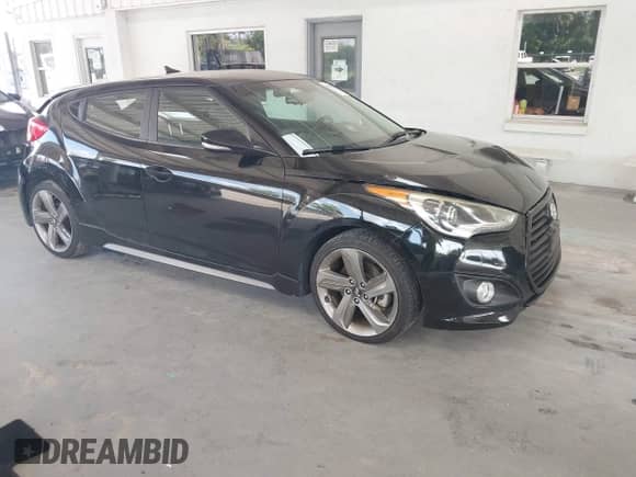 2013 Hyundai Veloster Turbo с VIN KMHTC6AEXDU167848, выставлен на аукционе IAAI как лот 43353403 с пробегом 84 077 миль миль и . История ставок и продаж доступна на DreamBid. Изображение 1.