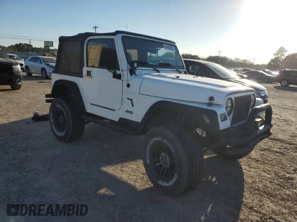 1999 Jeep Wrangler Sport with VIN 1J4FY19SXXP412760, listed as a Copart auction lot 84983895 with 180,172 mi miles and Clean title. Bid and sale history available at DreamBid. Image 4.