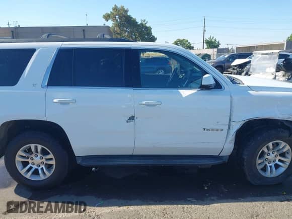 2015 Chevrolet Tahoe LT with VIN 1GNSKBKC4FR618116, listed as a IAAI auction lot 43056971 with 225,356 mi miles and . Bid and sale history available at DreamBid. Image 13.