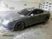 2007 Hyundai Tiburon GS с VIN KMHHM66D57U261613, выставлен на аукционе Copart как лот 57821245 с пробегом 185 489 миль миль и Списание • Salvage title. История ставок и продаж доступна на DreamBid. Изображение 1.