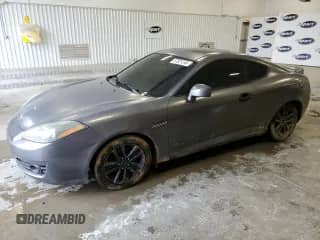 2007 Hyundai Tiburon GS с VIN KMHHM66D57U261613, выставлен на аукционе Copart как лот 57821245 с пробегом 185 489 миль миль и Списание • Salvage title. История ставок и продаж доступна на DreamBid. Изображение 1.