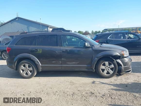 2014 Dodge Journey SE with VIN 3C4PDDAG5ET279249, listed as a IAAI auction lot 43113809 with 205,829 mi miles and . Bid and sale history available at DreamBid. Image 13.
