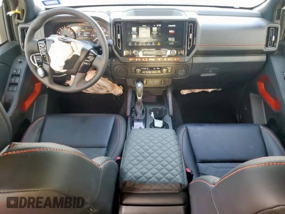 2025 Nissan Frontier Pro-X with VIN 1N6ED1EJXSN637854, listed as a Copart auction lot 65409335 with 2,410 mi miles and Salvage title. Bid and sale history available at DreamBid. Image 8.