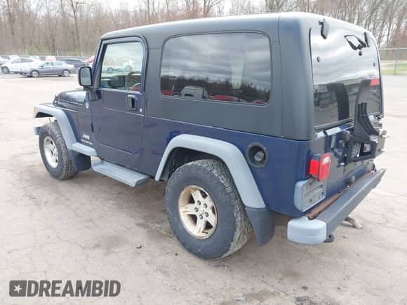 2005 Jeep Wrangler with VIN 1J4FA44585P364417, listed as a IAAI auction lot 42028538 with 206,545 mi miles and . Bid and sale history available at DreamBid. Image 3.