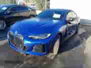 2024 BMW i4 eDrive40 with VIN WBY73AW07RFS43770, listed as a IAAI auction lot 41689504 with 14,684 mi miles and . Bid and sale history available at DreamBid. Image 2.