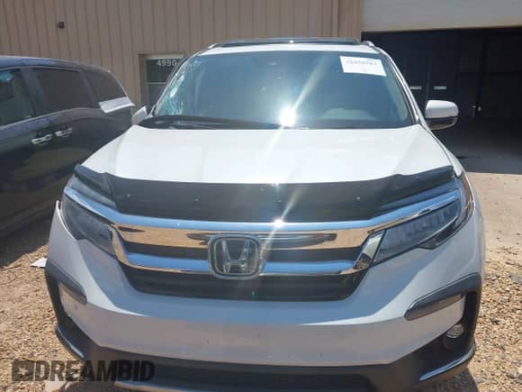 2022 Honda Pilot Touring 8-Passenger with VIN 5FNYF5H96NB004676, listed as a IAAI auction lot 42636581 with 23,428 mi miles and . Bid and sale history available at DreamBid. Image 12.
