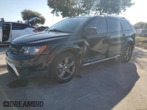 2015 Dodge Journey Crossroad with VIN 3C4PDCGG1FT745701, listed as a Copart auction lot 87430565 with 140,613 mi miles and Salvage title. Bid and sale history available at DreamBid. Image 1.