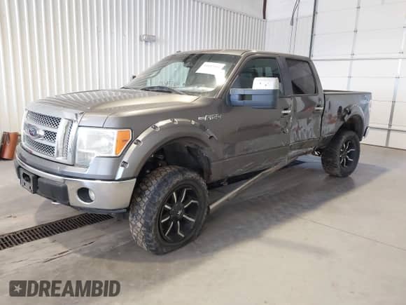 2012 Ford F-150 Lariat with VIN 1FTFW1E64CFA50624, listed as a IAAI auction lot 41687642 with 318,969 mi miles and . Bid and sale history available at DreamBid. Image 2.