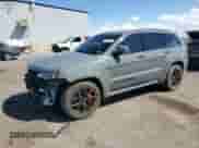 2019 Jeep Grand Cherokee SRT with VIN 1C4RJFDJ9KC784156, listed as a Copart auction lot 82126895 with 92,516 mi miles and Salvage title. Bid and sale history available at DreamBid. Image 1.