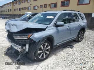 2023 Honda Pilot Touring с VIN 5FNYG2H75PB011423, выставлен на аукционе Copart как лот 60784185 с пробегом 8 214 миль миль и Списание • Salvage title. История ставок и продаж доступна на DreamBid. Изображение 1.