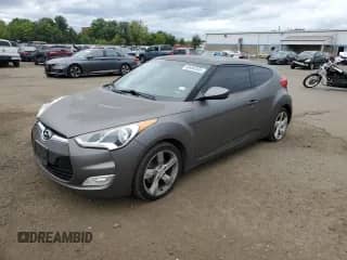 2014 Hyundai Veloster z VIN KMHTC6AD0EU196106, wystawiony jako Copart lot #69494305 z przebiegiem 102 472 mil mil oraz Szkoda całkowita • Salvage title. Historia ofert i sprzedaży dostępna na DreamBid. Obrazek 1.
