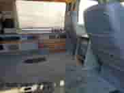 1999 Ford Econoline Cargo Recreational with VIN 1FDRE14L6XHC18387, listed as a Copart auction lot 46744285 with 138,588 mi miles and Salvage title. Bid and sale history available at DreamBid. Image 11.