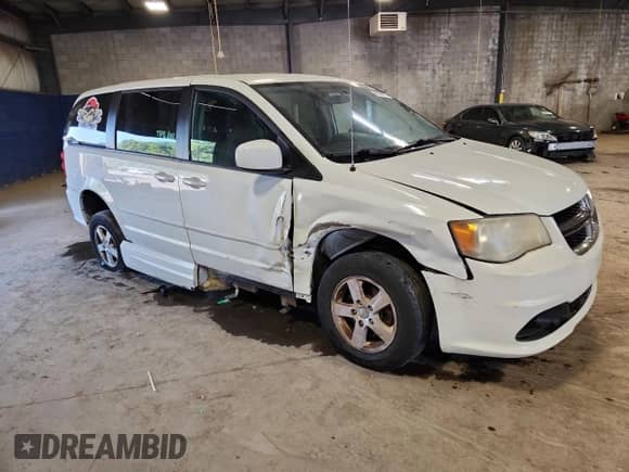 2011 Dodge Grand Caravan Mainstreet with VIN 2D4RN3DG2BR626839, listed as a Copart auction lot 80804825 with 143,663 mi miles and Salvage title. Bid and sale history available at DreamBid. Image 4.