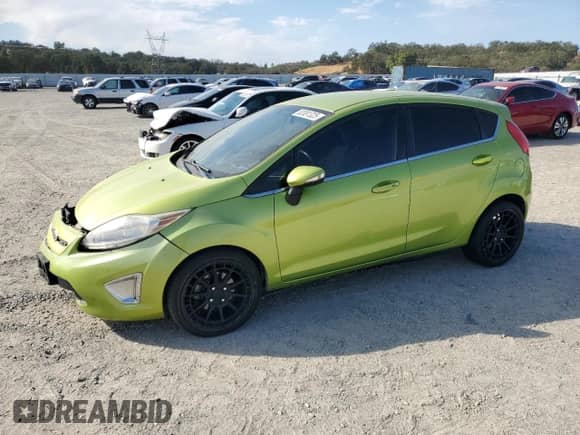 2011 Ford Fiesta SES with VIN 3FADP4FJ5BM157100, listed as a Copart auction lot 82081325 with 77,710 mi miles and Salvage title. Bid and sale history available at DreamBid. Image 1.
