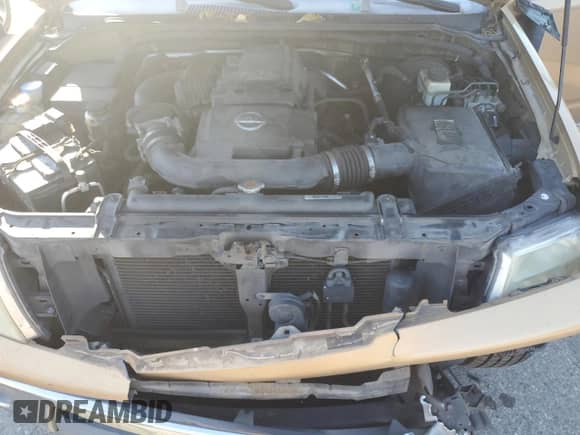 2005 Nissan Frontier SE z VIN 1N6AD06W95C403370, wystawiony jako Copart lot #82293115 z przebiegiem 263 899 mil mil oraz Szkoda całkowita • Salvage title. Historia ofert i sprzedaży dostępna na DreamBid. Obrazek 11.