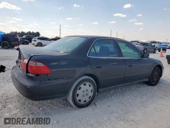 1999 Honda Accord LX with VIN JHMCG5644XC004088, listed as a Copart auction lot 84821185 with 150,948 mi miles and Salvage title. Bid and sale history available at DreamBid. Image 3.