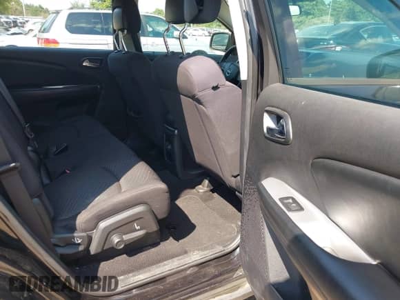 2013 Dodge Journey American Value z VIN 3C4PDCAB1DT665342, wystawiony jako IAAI lot #43204169 z przebiegiem 165 036 mil mil oraz . Historia ofert i sprzedaży dostępna na DreamBid. Obrazek 8.