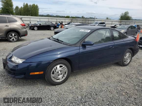 1999 Saturn SC with VIN 1G8ZY1273XZ328268, listed as a Copart auction lot 61796915 with 151,562 mi miles and Salvage title. Bid and sale history available at DreamBid. Image 1.