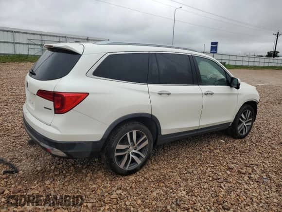 2018 Honda Pilot Touring z VIN 5FNYF5H92JB009576, wystawiony jako Copart lot #64393635 z przebiegiem 101 546 mil mil oraz Szkoda całkowita • Salvage title. Historia ofert i sprzedaży dostępna na DreamBid. Obrazek 3.