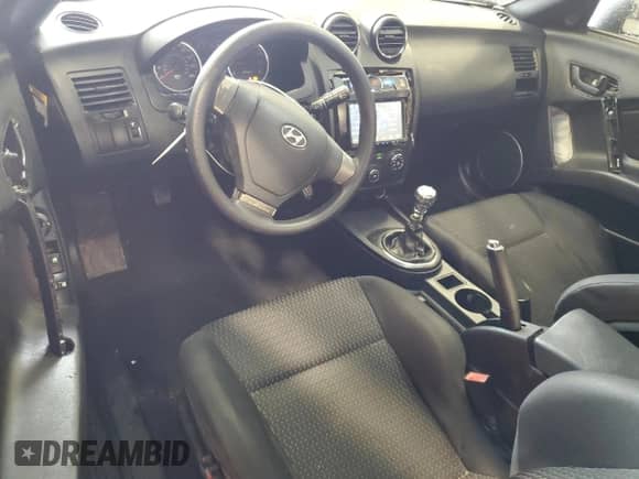 2007 Hyundai Tiburon GS с VIN KMHHM66D57U261613, выставлен на аукционе Copart как лот 57821245 с пробегом 185 489 миль миль и Списание • Salvage title. История ставок и продаж доступна на DreamBid. Изображение 8.