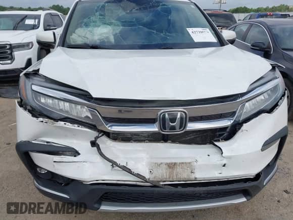 2021 Honda Pilot Elite with VIN 5FNYF6H04MB079091, listed as a IAAI auction lot 42739979 with 62,723 mi miles and . Bid and sale history available at DreamBid. Image 18.