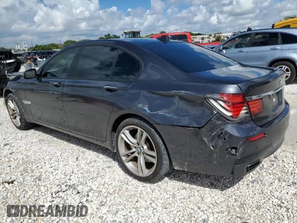 2015 BMW 7 Series 740i с VIN WBAYA6C50FGK16244, выставлен на аукционе Copart как лот 84005165 с пробегом 137 489 миль миль и Списание • Salvage title. История ставок и продаж доступна на DreamBid. Изображение 2.