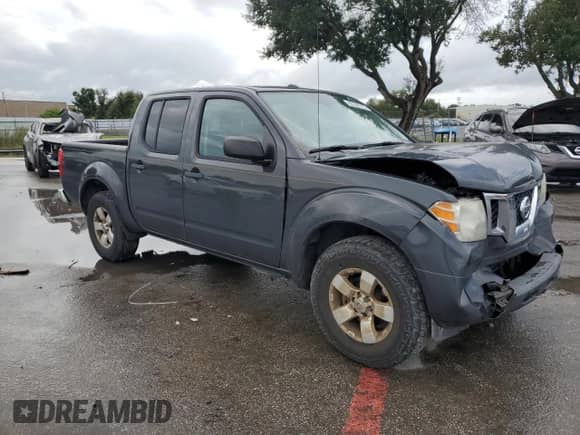 2015 Nissan Frontier SV with VIN 1N6AD0ERXFN761126, listed as a Copart auction lot 82246165 with 194,069 mi miles and Salvage title. Bid and sale history available at DreamBid. Image 4.