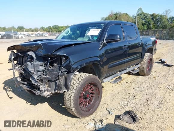 2020 Toyota Tacoma SR5 with VIN 3TMCZ5AN0LM331088, listed as a IAAI auction lot 43270787 with 69,590 mi miles and . Bid and sale history available at DreamBid. Image 2.
