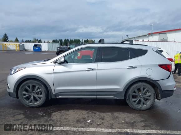 2018 Hyundai Santa Fe Ultimate with VIN 5XYZWDLA7JG542869, listed as a IAAI auction lot 41889520 with 51,294 mi miles and . Bid and sale history available at DreamBid. Image 14.