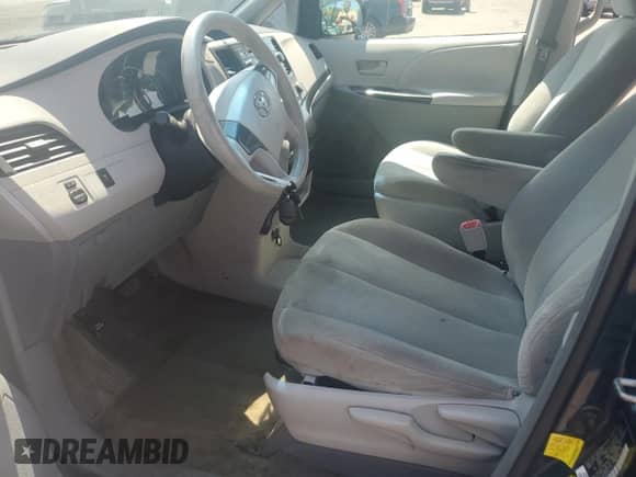 2012 Toyota Sienna with VIN 5TDZK3DC4CS237227, listed as a Copart auction lot 68947005 with 219,993 mi miles and Salvage title. Bid and sale history available at DreamBid. Image 7.