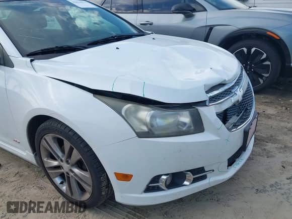 2013 Chevrolet Cruze LTZ z VIN 1G1PG5SB7D7224670, wystawiony jako IAAI lot #42814171 z przebiegiem 189 170 mil mil oraz . Historia ofert i sprzedaży dostępna na DreamBid. Obrazek 13.