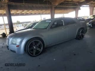 2007 Chrysler 300 with VIN 2C3KA43R37H785728, listed as a Copart auction lot 82369005 with 140,326 mi miles and Salvage title. Bid and sale history available at DreamBid. Image 1.