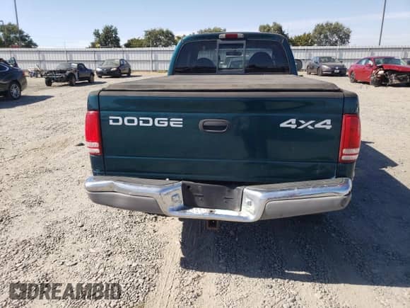 1999 Dodge Dakota SLT z VIN 1B7GG22Y0XS235487, wystawiony jako Copart lot #67135275 z przebiegiem 142 222 mil mil oraz Czysty tytuł • Clean title. Historia ofert i sprzedaży dostępna na DreamBid. Obrazek 6.