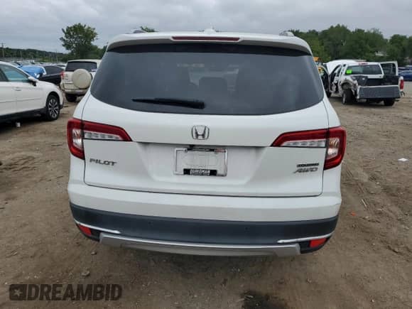 2020 Honda Pilot Touring 8-Passenger z VIN 5FNYF6H97LB018959, wystawiony jako Copart lot #69568995 z przebiegiem 106 671 mil mil oraz Szkoda całkowita • Salvage title. Historia ofert i sprzedaży dostępna na DreamBid. Obrazek 6.
