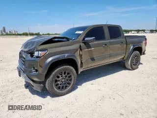 2023 Chevrolet Colorado 4WD Trail Boss с VIN 1GCPTEEKXP1133253, выставлен на аукционе Copart как лот 70961615 с пробегом 33 839 миль миль и Списание • Salvage title. История ставок и продаж доступна на DreamBid. Изображение 1.