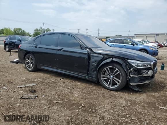 2016 BMW 7 Series 750i xDrive with VIN WBA7F2C5XGG417558, listed as a Copart auction lot 65567865 with 94,441 mi miles and Salvage title. Bid and sale history available at DreamBid. Image 4.
