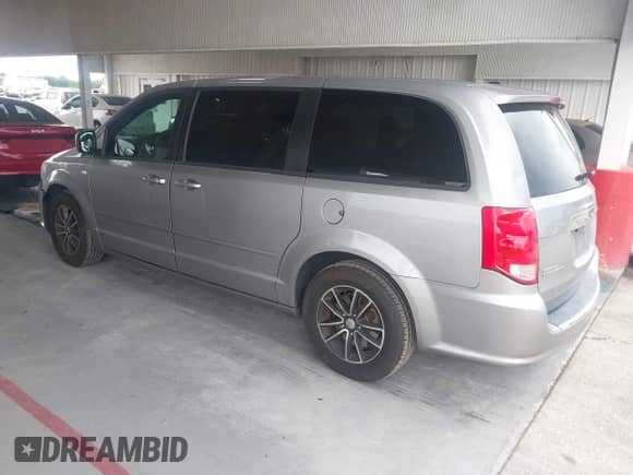 2014 Dodge Grand Caravan SE with VIN 2C4RDGBG3ER412053, listed as a IAAI auction lot 42663202 with 246,888 mi miles and . Bid and sale history available at DreamBid. Image 3.
