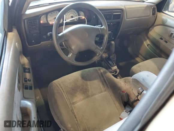 2002 Toyota Tacoma z VIN 5TEWM72N82Z091926, wystawiony jako Copart lot #86238225 z przebiegiem 229 921 mil mil oraz Czysty tytuł • Clean title. Historia ofert i sprzedaży dostępna na DreamBid. Obrazek 8.