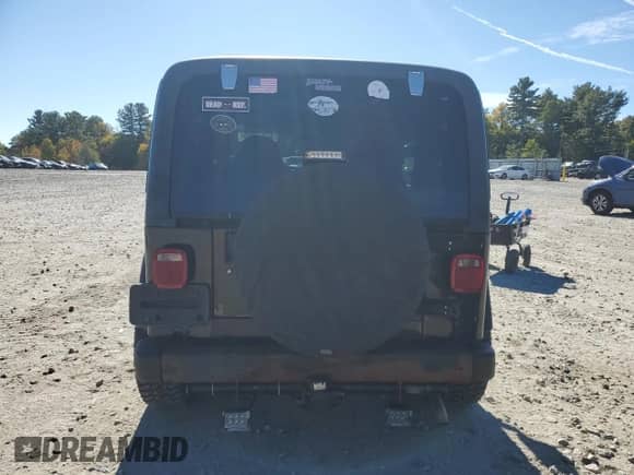 2000 Jeep Wrangler Sport with VIN 1J4FA49S1YP796600, listed as a Copart auction lot 82574545 with 128,340 mi miles and Clean title. Bid and sale history available at DreamBid. Image 6.