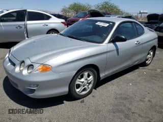 2001 Hyundai Tiburon с VIN KMHJG25F11U258137, выставлен на аукционе Copart как лот 63812855 с пробегом 27 682 миль миль и Чистый • Clean title. История ставок и продаж доступна на DreamBid. Изображение 1.