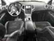 2012 Jeep Grand Cherokee SRT-8 z VIN 1C4RJFDJ2CC111226, wystawiony jako Copart lot #74449424 z przebiegiem 113 515 mil mil oraz Czysty tytuł • Clean title. Historia ofert i sprzedaży dostępna na DreamBid. Obrazek 9.