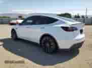 2022 Tesla Model Y Performance with VIN 7SAYGDEFXNF406995, listed as a Copart auction lot 70490065 with 96,088 mi miles and Salvage title. Bid and sale history available at DreamBid. Image 2.