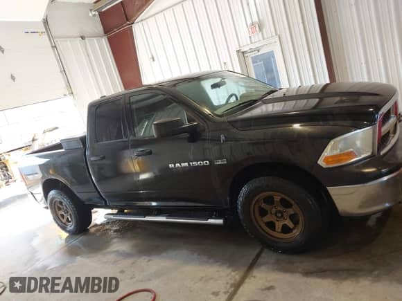 2011 Ram 1500 Big Horn with VIN 1D7RB1GT2BS669617, listed as a IAAI auction lot 43242457 with 141,848 mi miles and . Bid and sale history available at DreamBid. Image 13.